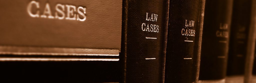 A row of law cases books on a shelf.